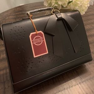 Black feminine but professional briefcase.